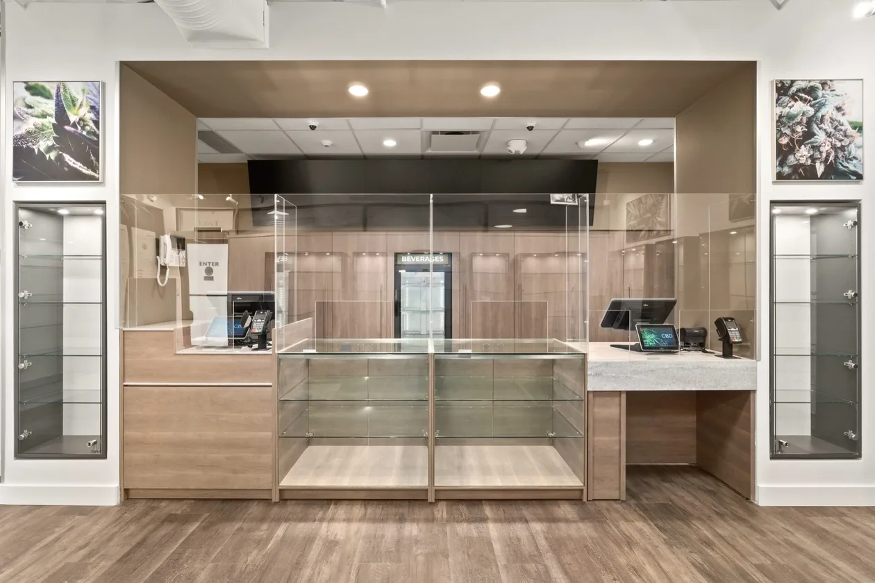Service and pickup counter with timber millwork and a glazed security screen