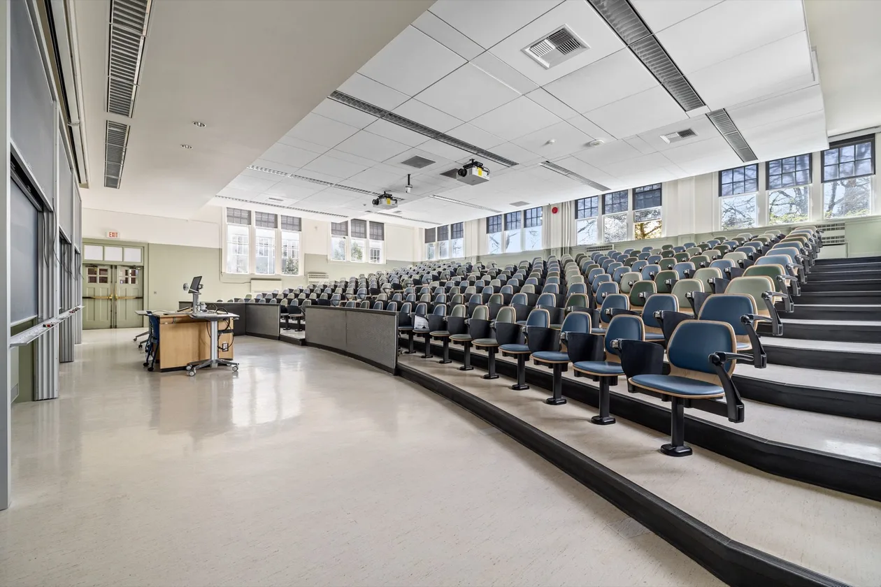 Math 100 lecture theatre with tiered fixed seating and instructor bench