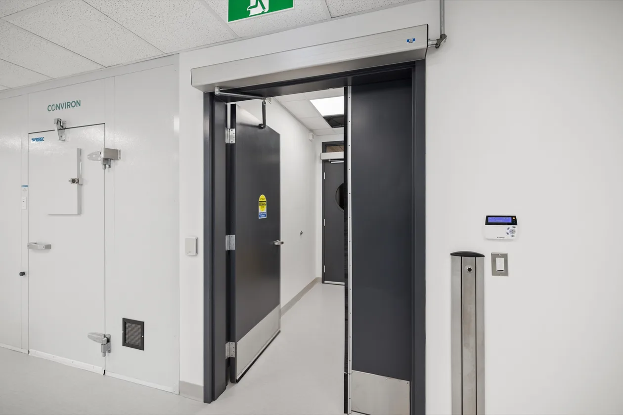 Corridor with the insulated environmental growth chamber door
