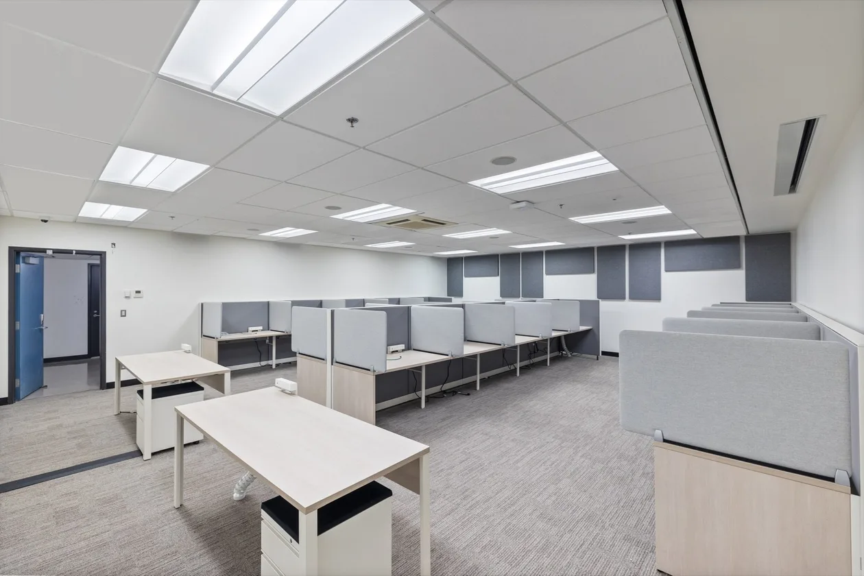 Open study area with partition screens, tables and carpet tile