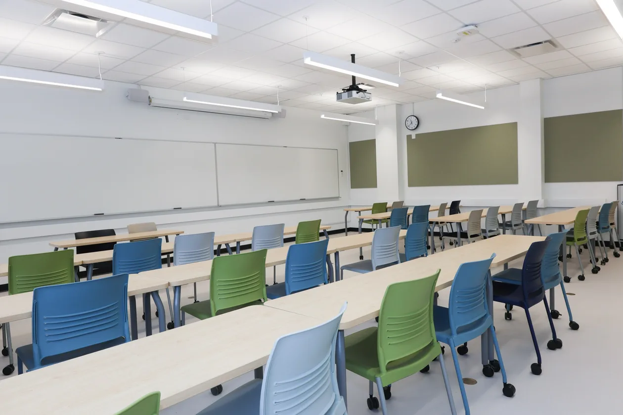 Rebuilt classroom seating rows and new finishes after renovation, UBC MacMillan Building.