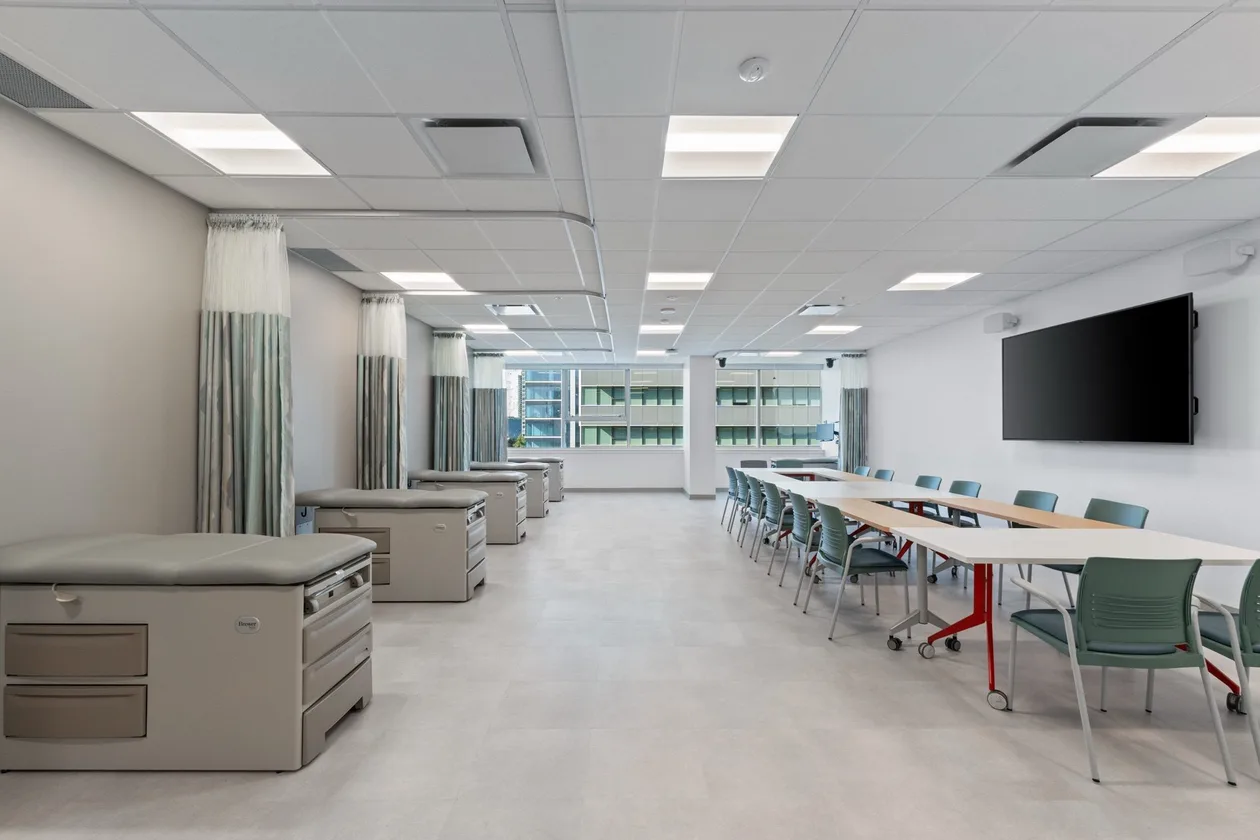 Clinical skills room with examination beds and a seminar table
